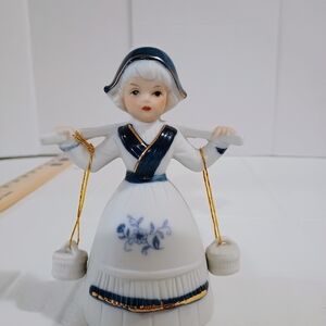 Porcelain Figurine with Blue Accents